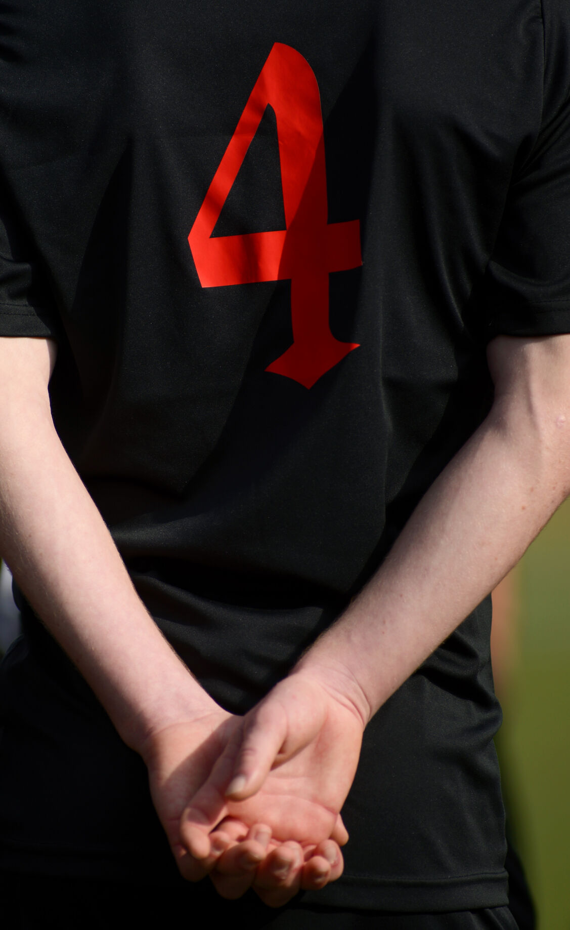 Southern Boone midfielder Jack Bigos holds his hands behind his back